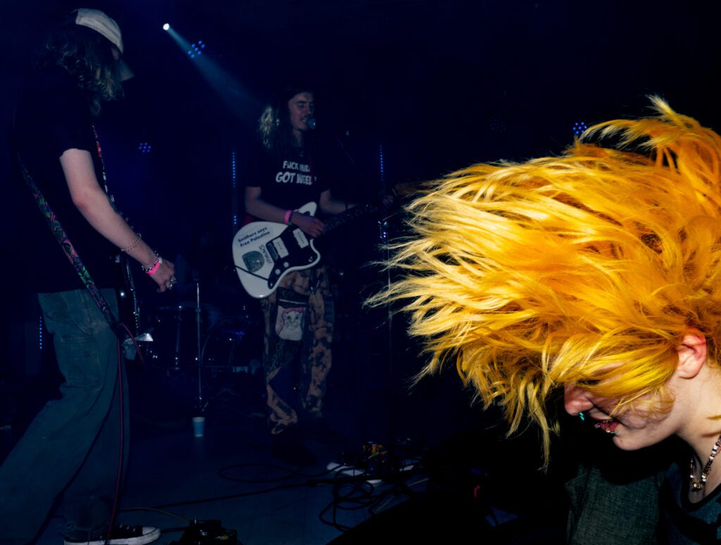 An audience member bobs their head back and forth Sunday during Smithers' set at the Blue Room.