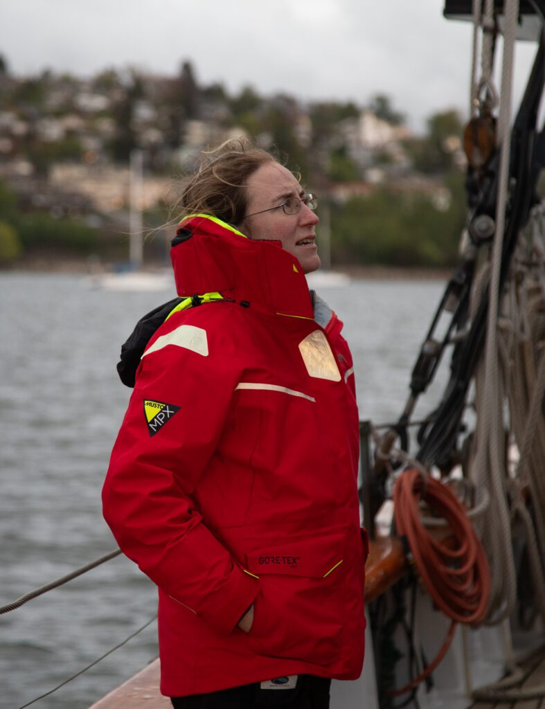 First mate Dana Raugi watches as the crew stows sails.