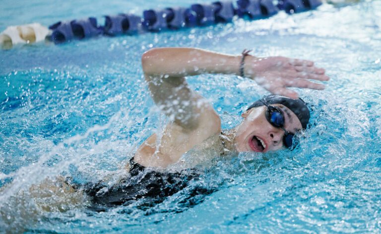 Blaine’s Hailey Ferrell breaches for air by emerging sideways mid-swim.