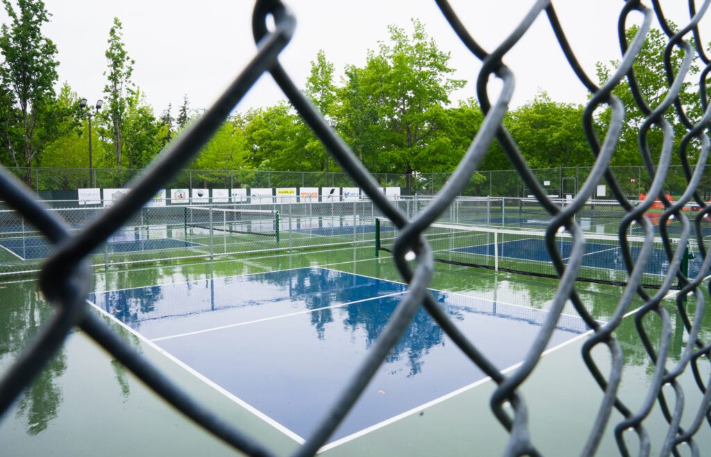 The tournament was originally supposed to be held on the outside courts but was moved inside due to weather.