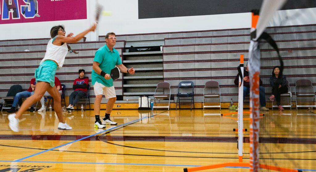 Julie Tookey, who earned the silver medal in the women's tournament the day before, and Paul Trudeau show their coordination in both the game and their outfits. The two have been playing together for about half a year and traveled down from Port Coquitlam, British Columbia, for the tournament.