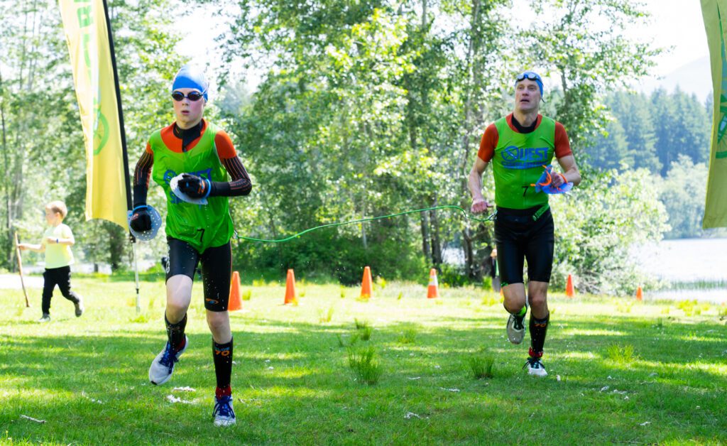 A father and son duo surge forward with the son leading the way.