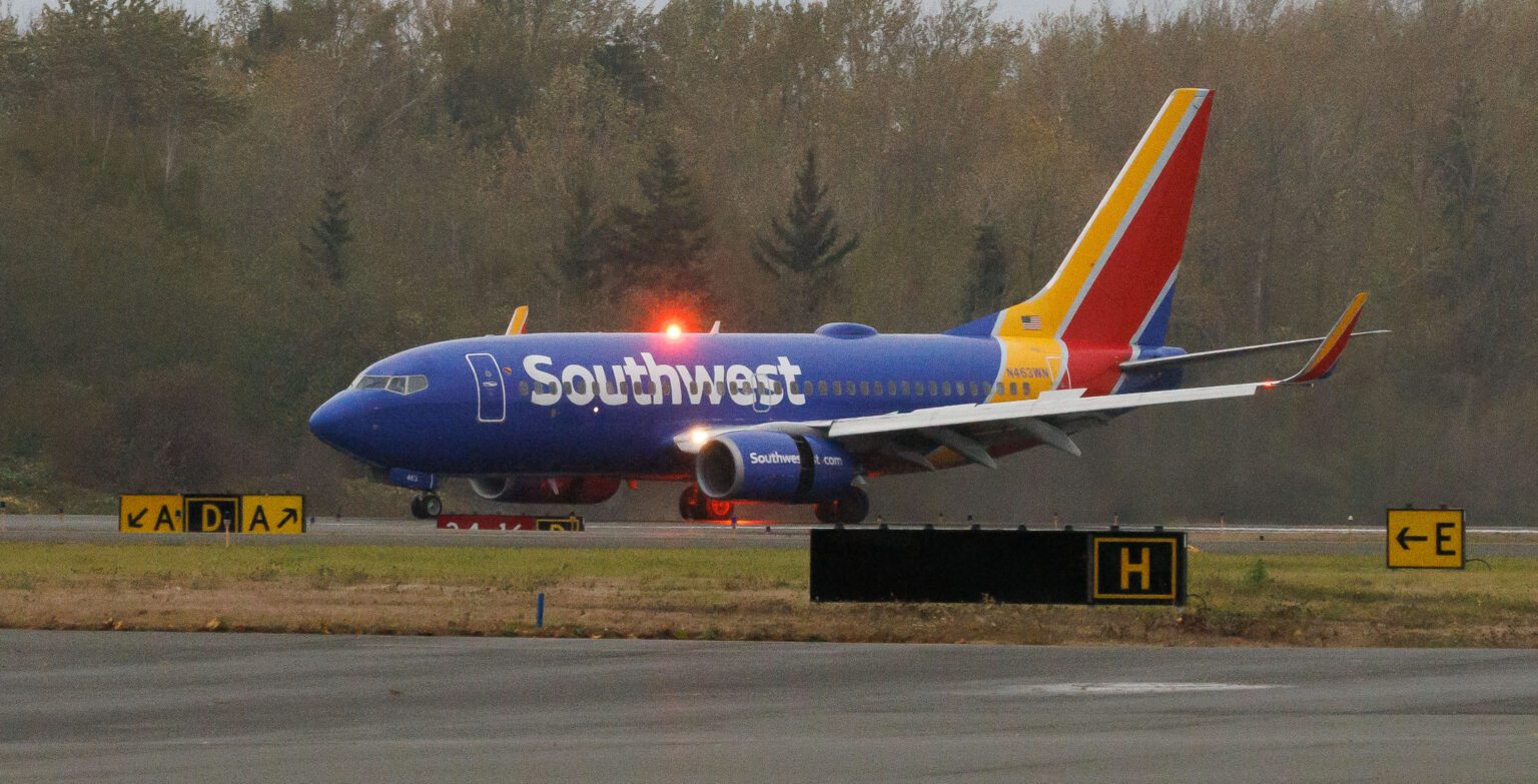 Southwest Airlines at the end of a runway, getting ready to begin the flight procedure.