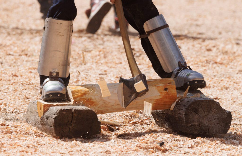 Looking like knight’s armor, a chopper’s shins and feet are protected during the logger relay.