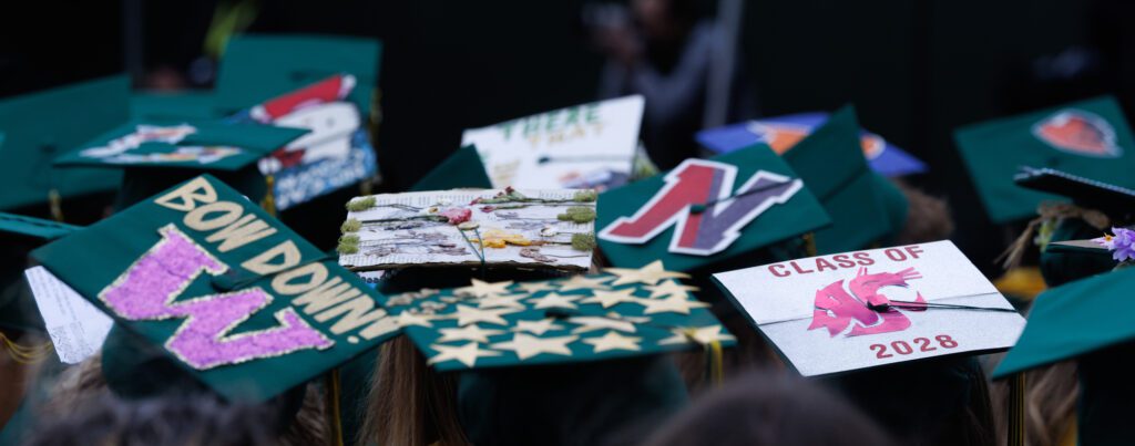 Decorated mortarboards are seen at the Sehome graduation ceremony.