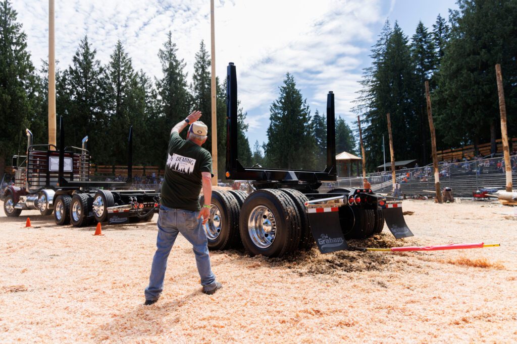 Once a pole has been hit, judge Steve MacDonald gives the stop signal to a driver during the trailer-backing competition.