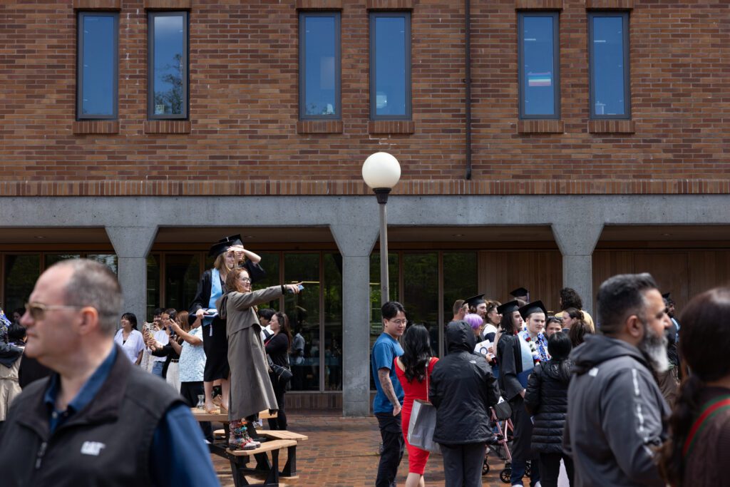 Graduates search for family and friends in a crowded Red Square.