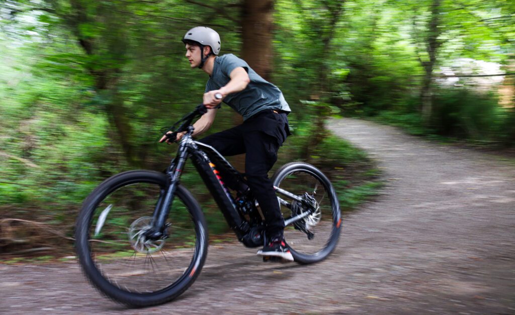 Michael Rodriguez speeds past on an electric mountain bike