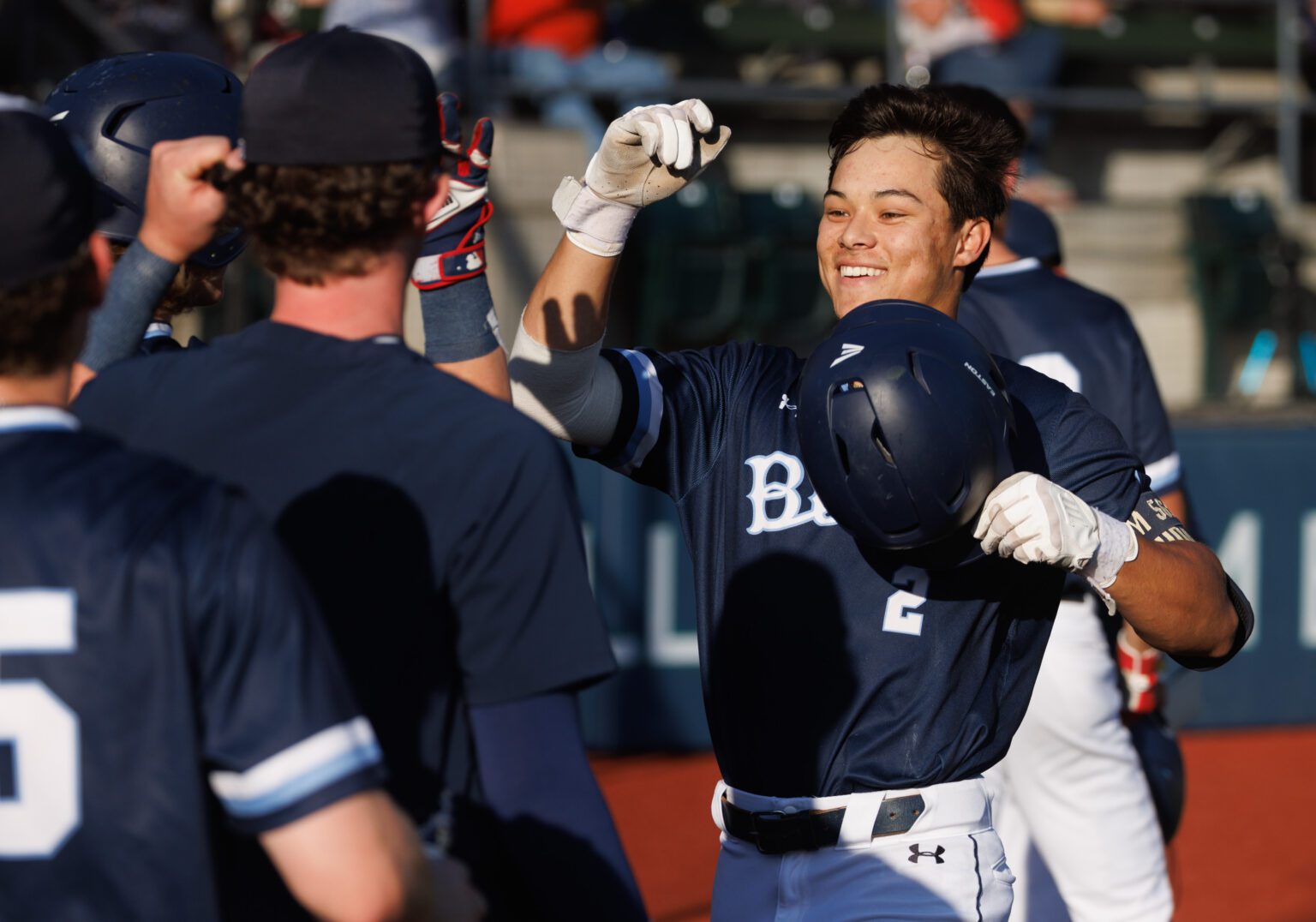 The Bellingham Bells' Cole Yoshida celebrates with teammates with elbow bumps.