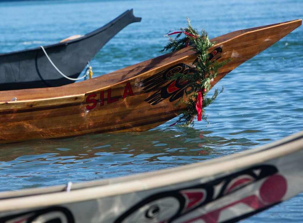 Canoes are prepared, ready to officially land at the Stommish Grounds.