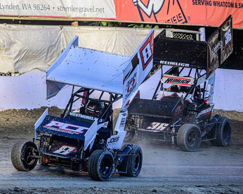 Rachel Westmoreland, front, and Jarrett Heimlich slide through a turn.