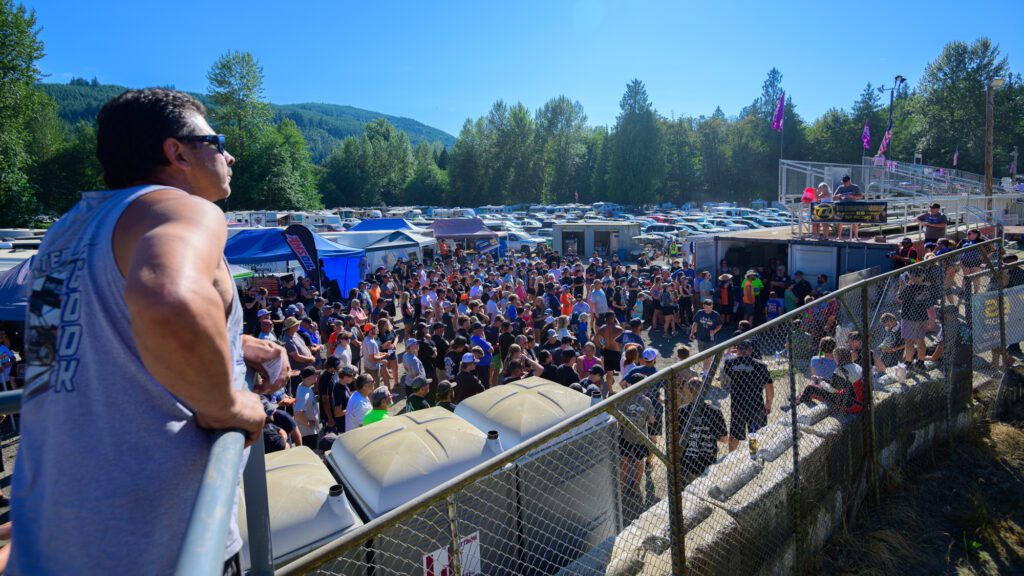 A pre-race drivers' meeting is held in the pit lane.