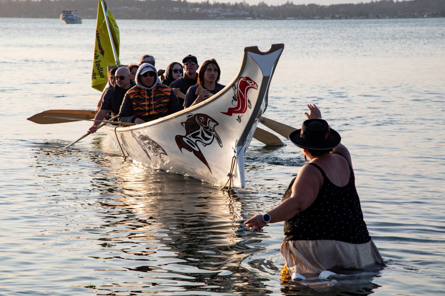 Chairwoman RoseMary LaClair of the Nooksack Indian Tribe welcomes members of the Swinomish Tribe in the Salmon Dancer Canoe at Birch Bay State Park on Monday, July 22.