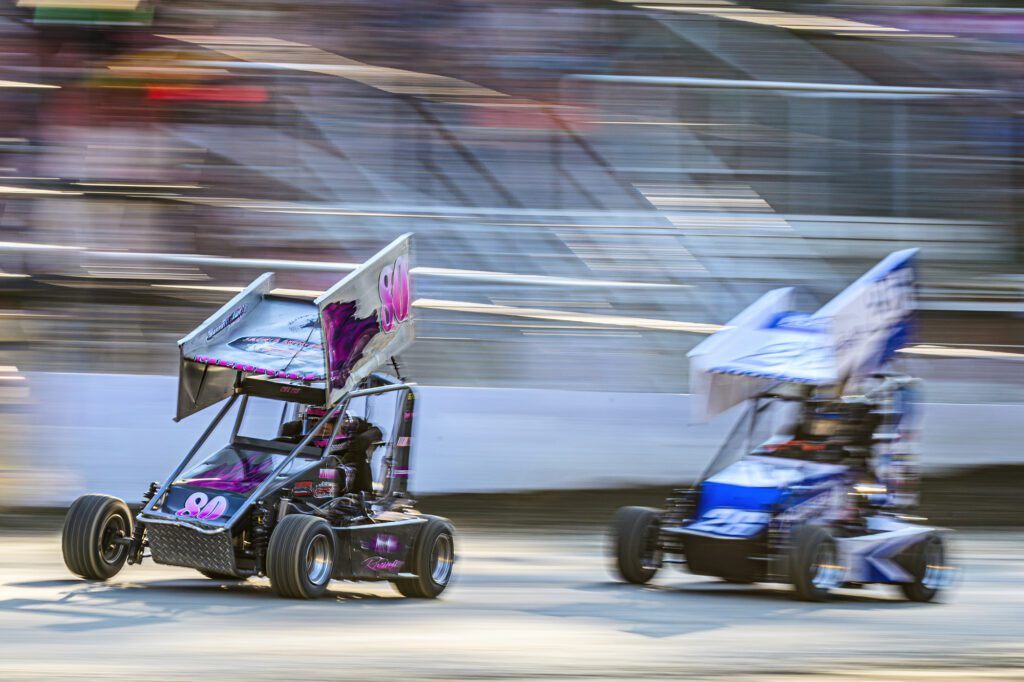 Mary Jane Merrill leads Amelia Rudeen along the straightaway in the junior sprint race.