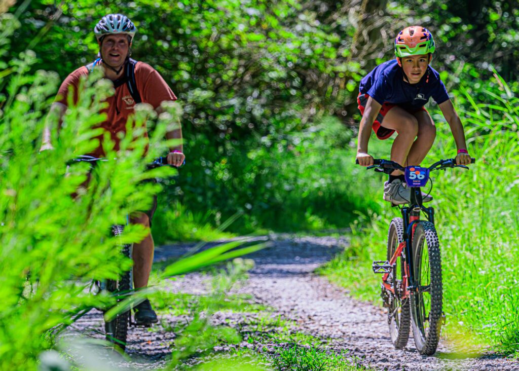 Anson, right, and Shawn Call ride near the Lost Lake Trailhead.