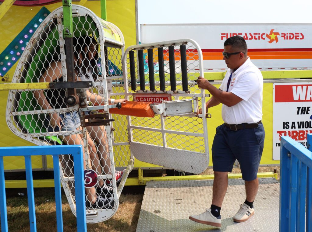 Riders are locked in the Zipper carnival ride.