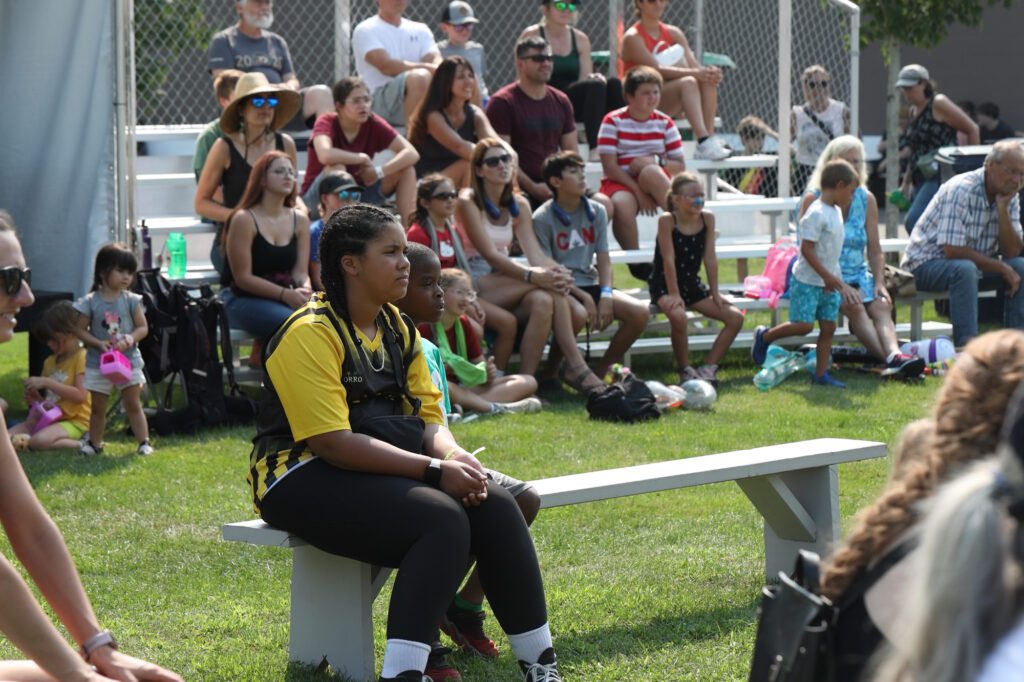 Dozens watch the Zuzu Acrobats.