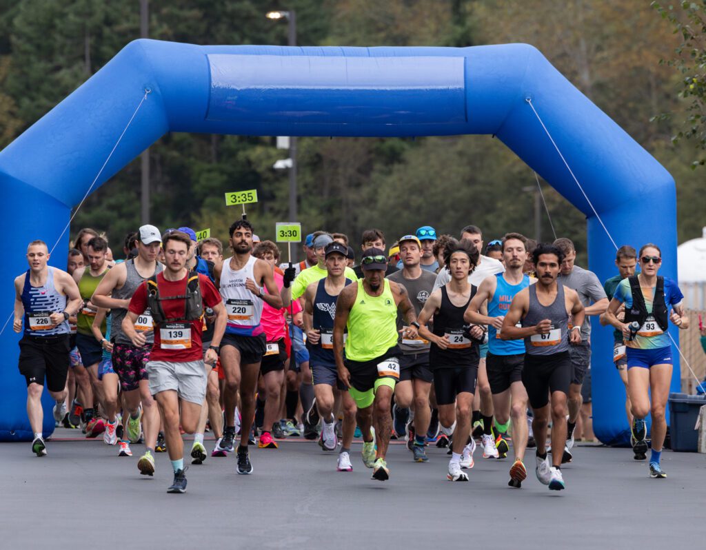 Runners take off from the starting line Sunday, Sept. 22 at Lummi Nation School to kick off the Bellingham Bay Marathon. Courtney Olsen (93) and Adrian Cedillo (67) defended their female and male titles, respectively.