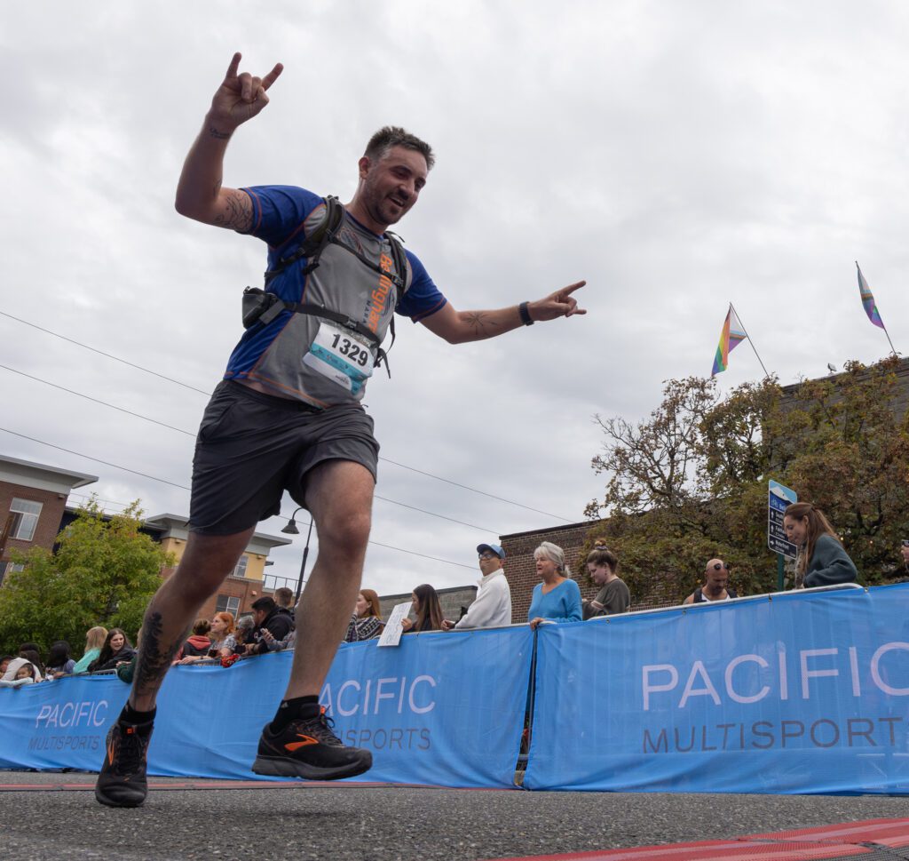 Ted Carter celebrates as he crosses the finish line.