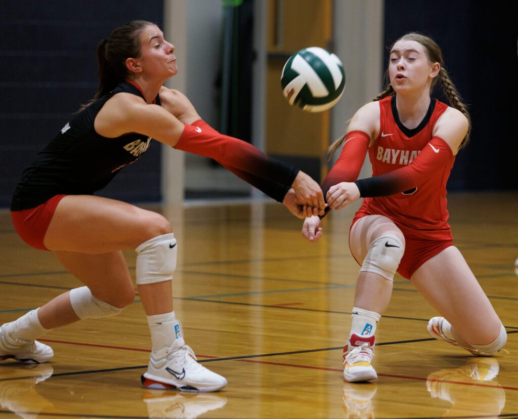 Bellingham’s Sonoma Smith and Ophelia Van Leeuwen reach to bump the ball.