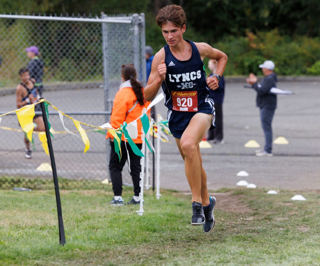 Lynden Christian's Nikolas Luce runs uphill. Luce placed second in the boys junior race.