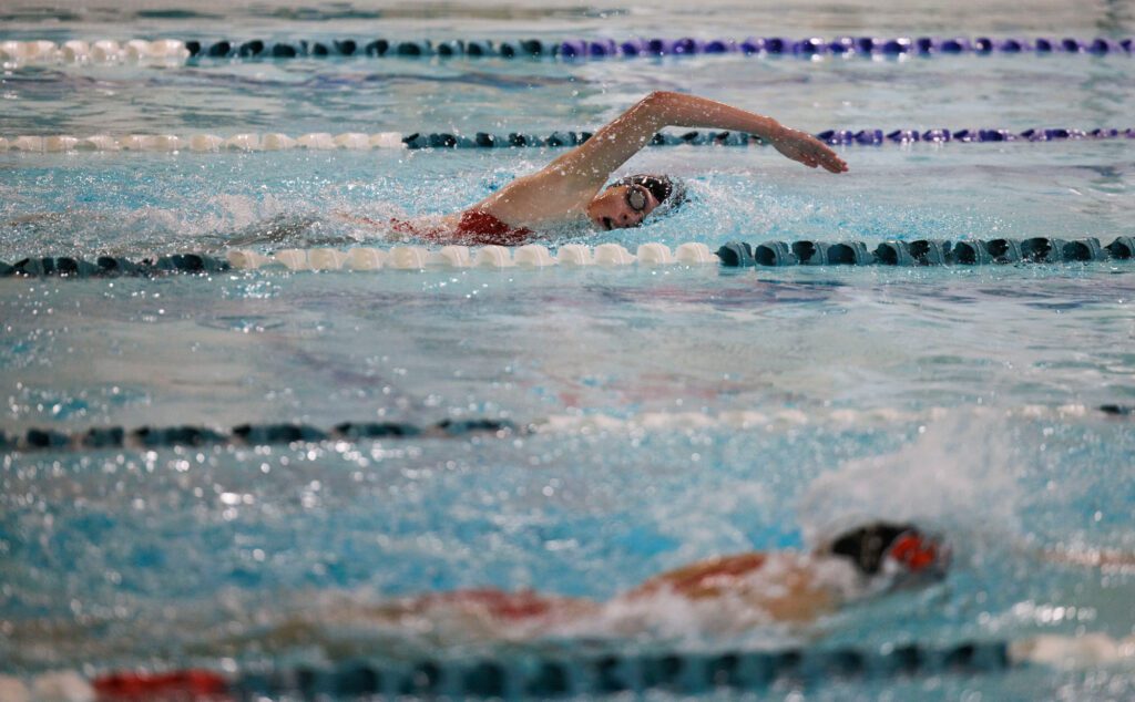 Bellingham’s Mandela Windrem leads her teammate during the 100-yard freestyle.