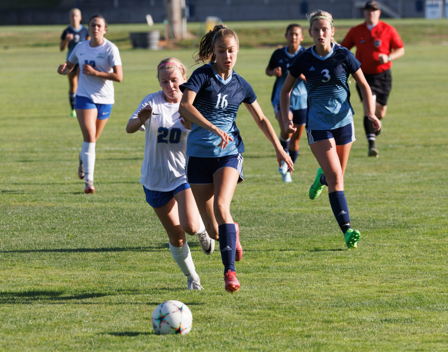 Lynden Christian's Addison Arnold runs down the ball near the goal.