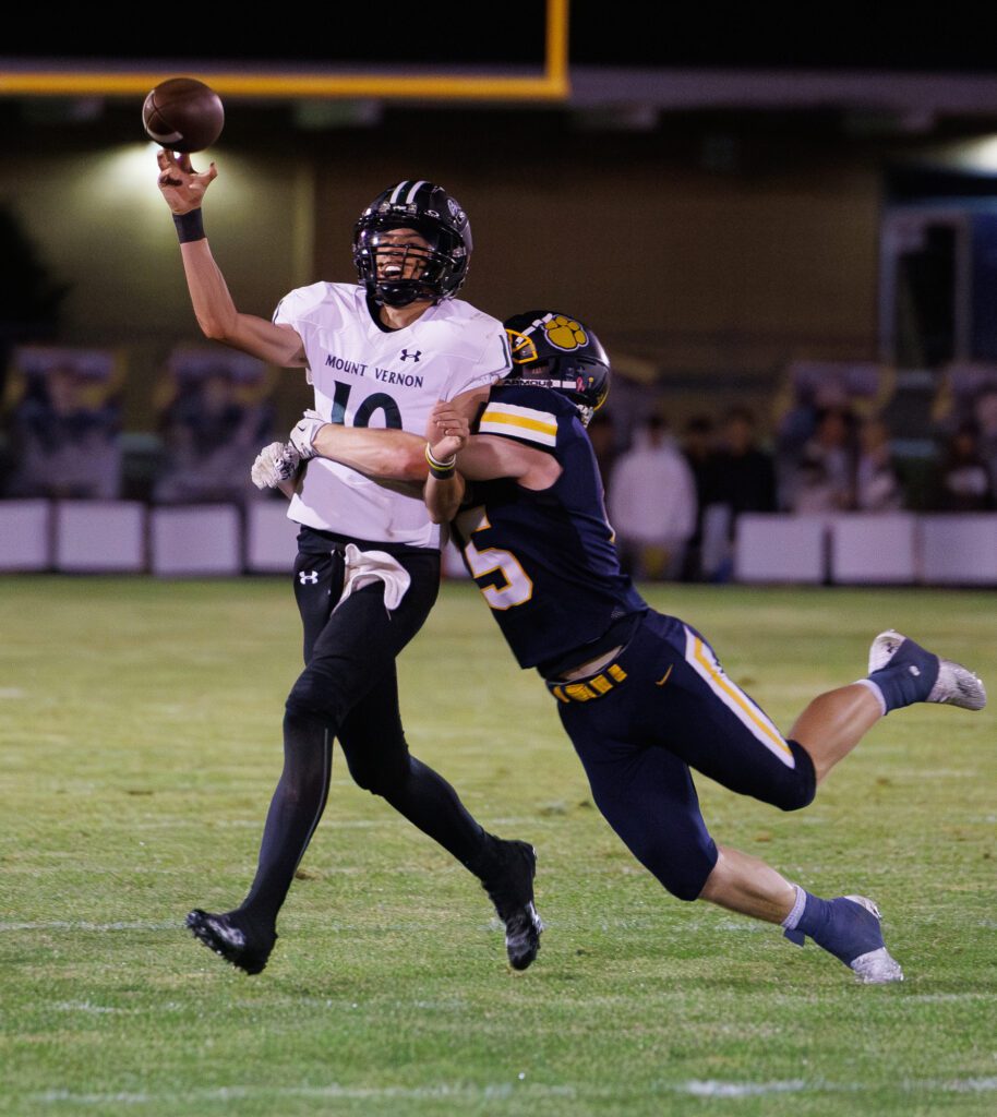 Burlington-Edison's Ryder Aldridge disrupts a pass by Mount Vernon's Kaiden Anderson.