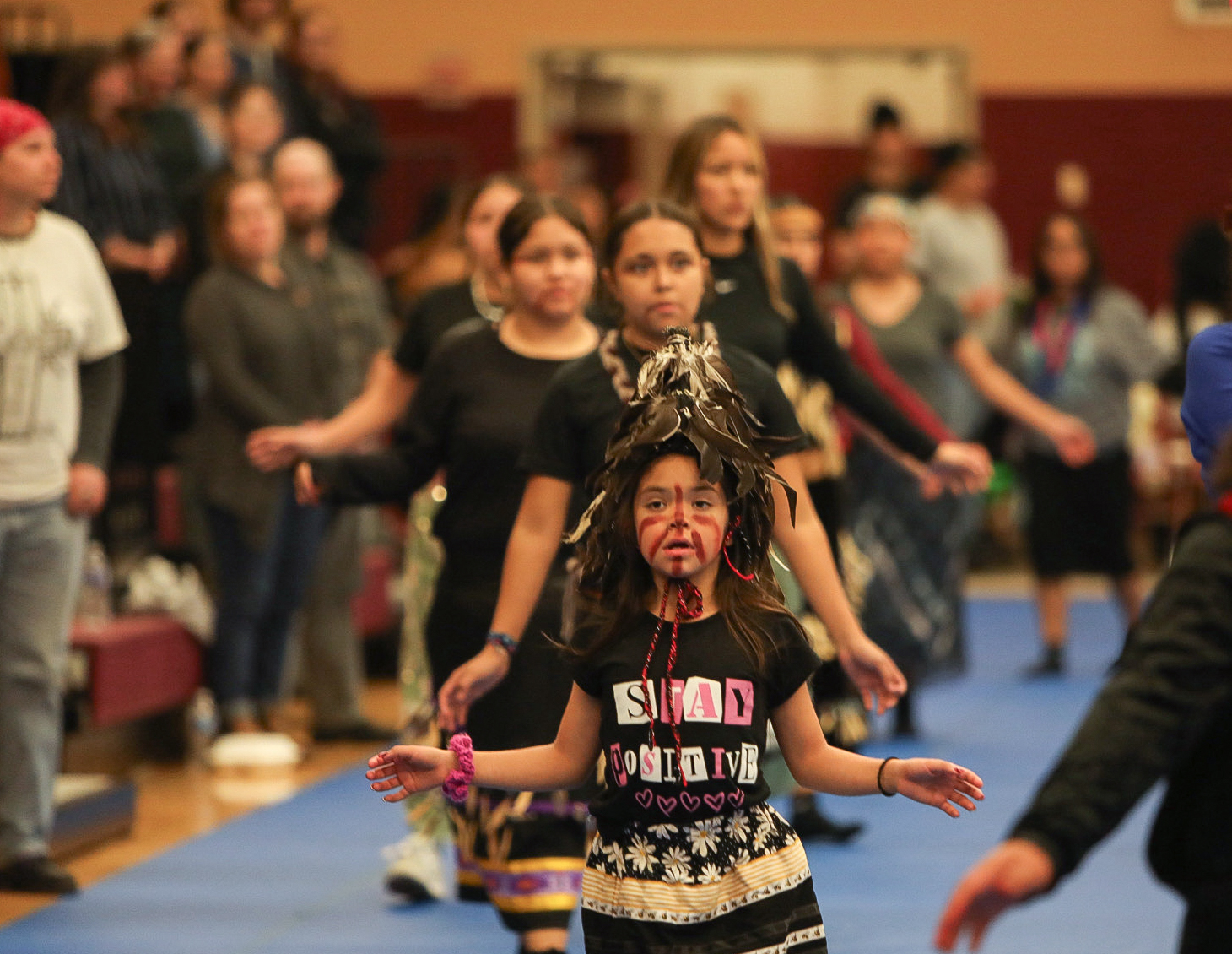 Blackhawk Dancers spin around the Lummi Nation School gymnasium to the steady beat of drums and singing Monday, Oct. 14. Hundreds attended the Indigenous Peoples Day event.