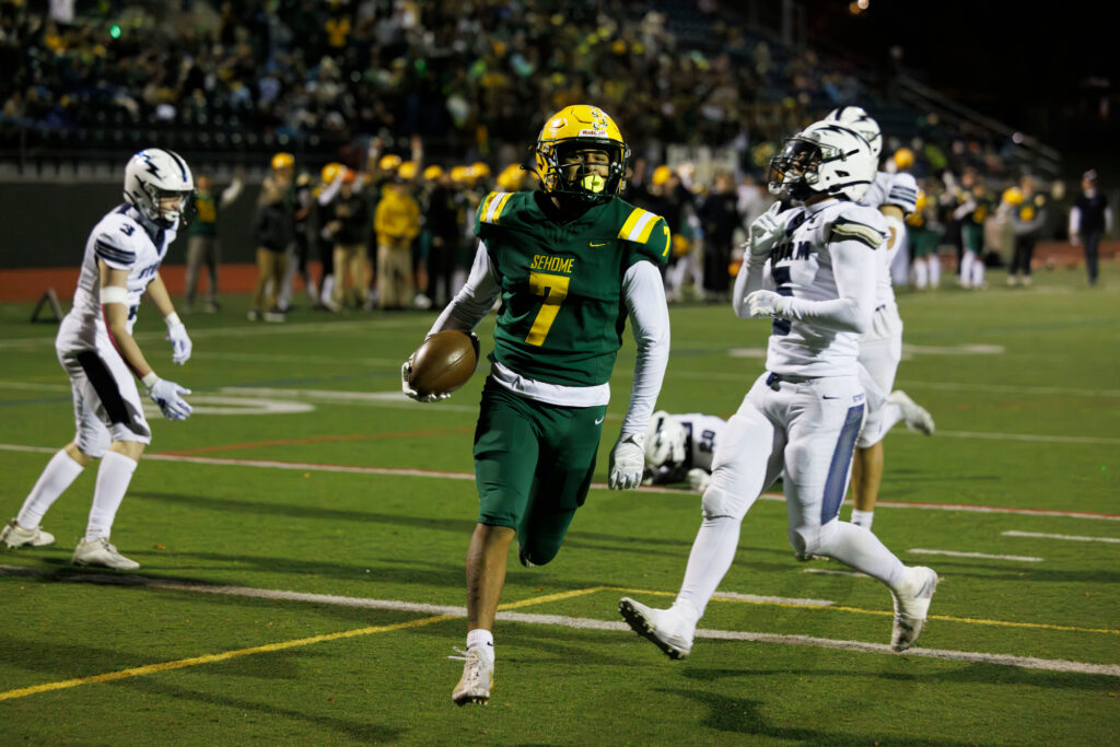 Sehome’s Andre Watson scores one of his three touchdown receptions Friday, Oct. 25 as the Mariners beat Squalicum 42-10 at Civic Stadium to clinch the 2A Northwest Conference's final playoff spot.