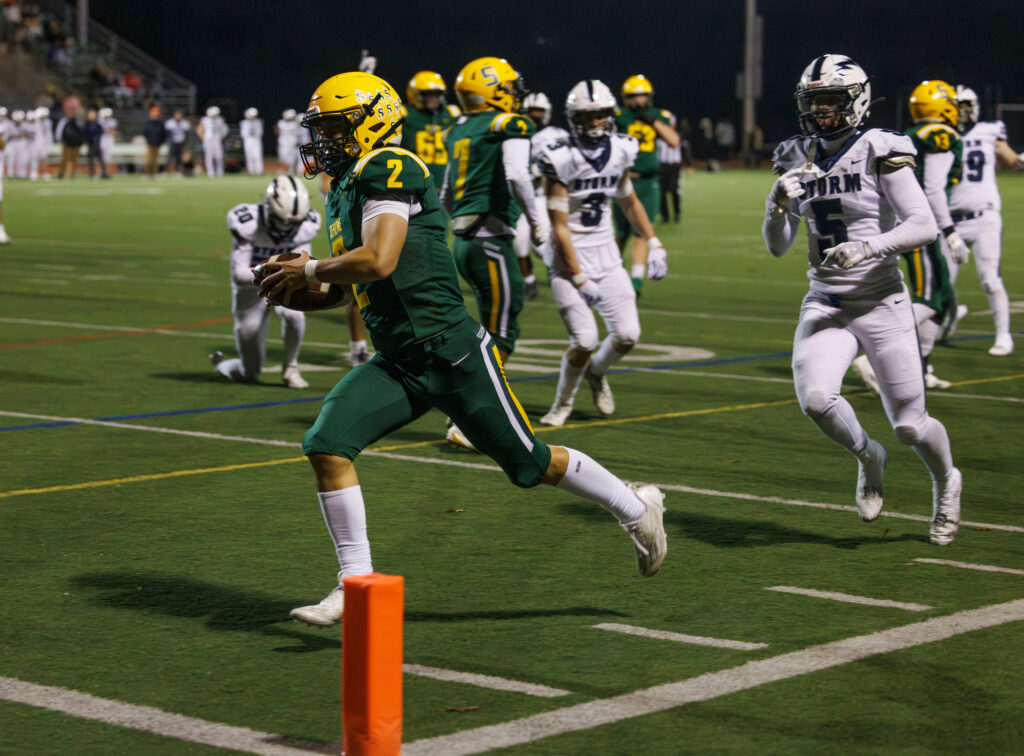 Sehome’s Nolan Wright runs in for a touchdown.