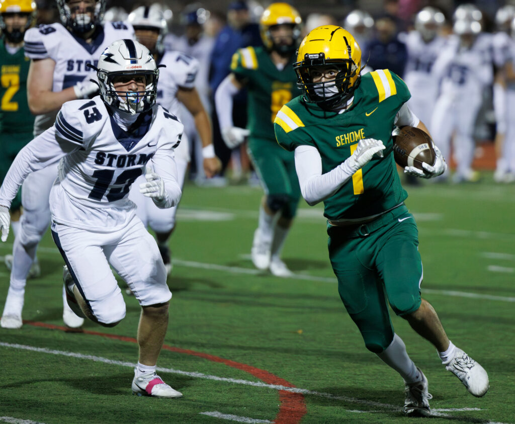 Sehome’s Coleby Chambers runs for a first down.