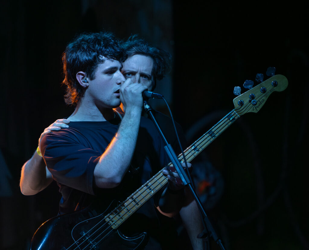 Nic Hutton of Normal Behavior plays the bass and sings with Atlas Genius during their set.