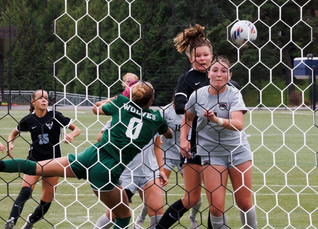 Western's Mie Cairns heads the ball on a corner kick.