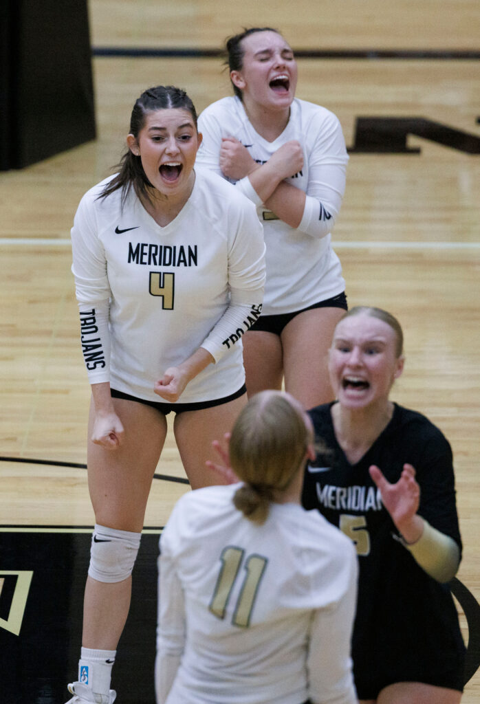 Meridian players celebrate tying up the game.