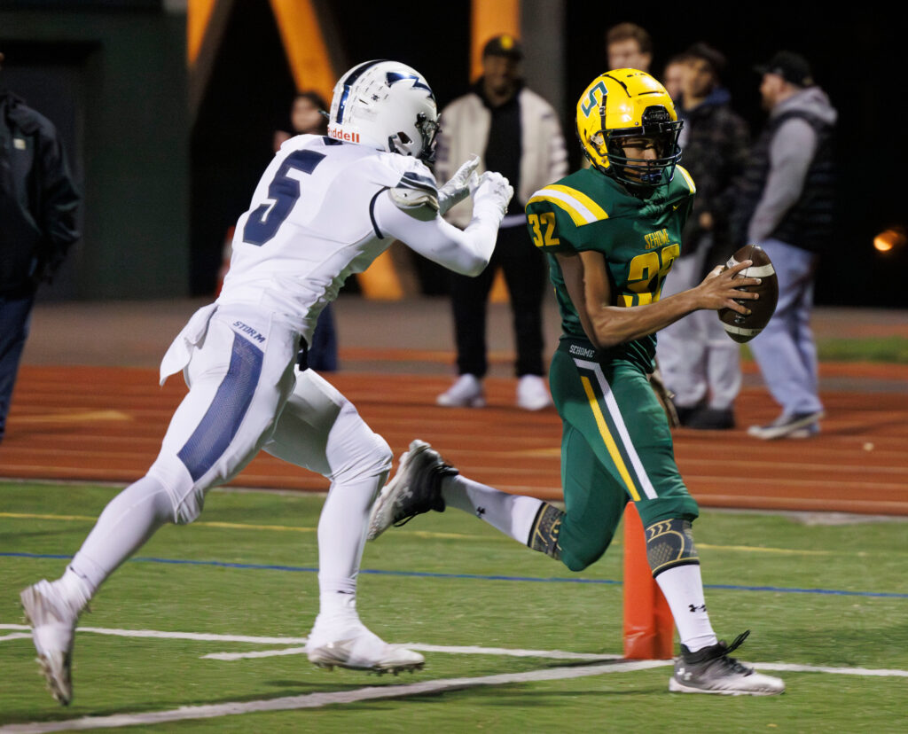 Sehome’s Solomon III McAlister beats a Squalicum defender to the end zone for a touchdown.