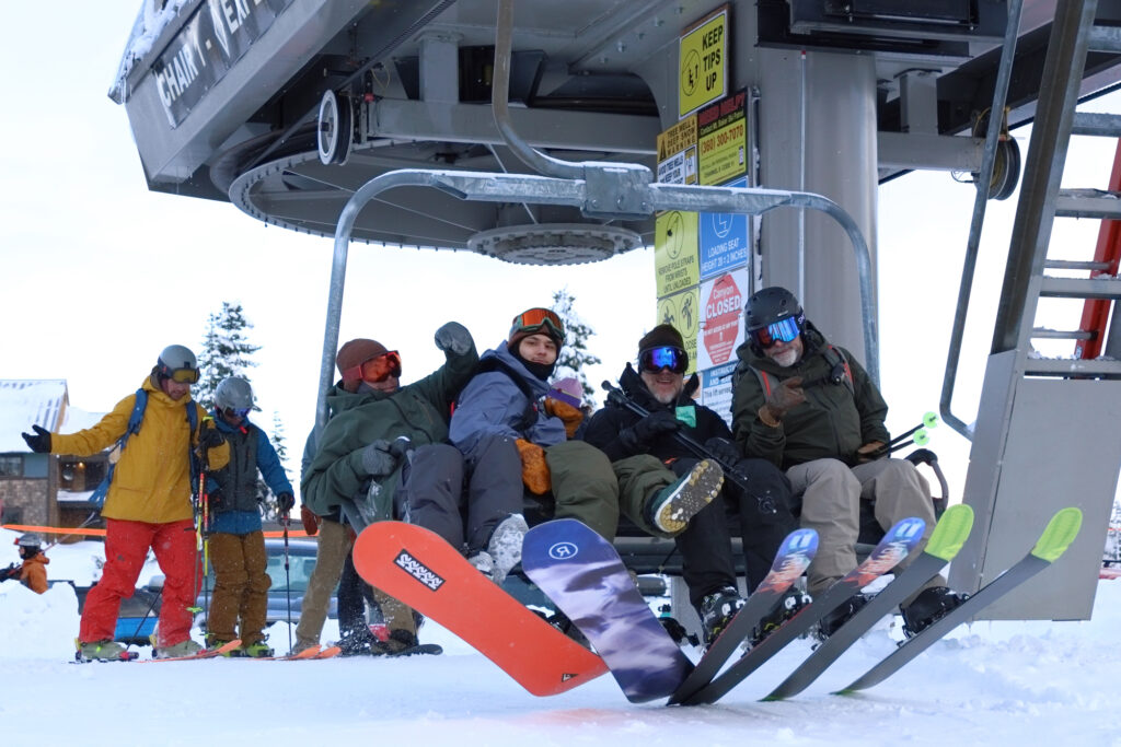 From left, Leon Reyes, 35, Joshua Chavarriq, 25, Fred Garvin, 61, and Gavin Gillespie, 54, catch the first lift of the regular season at Chair 1 at Mt. Baker Ski Area.