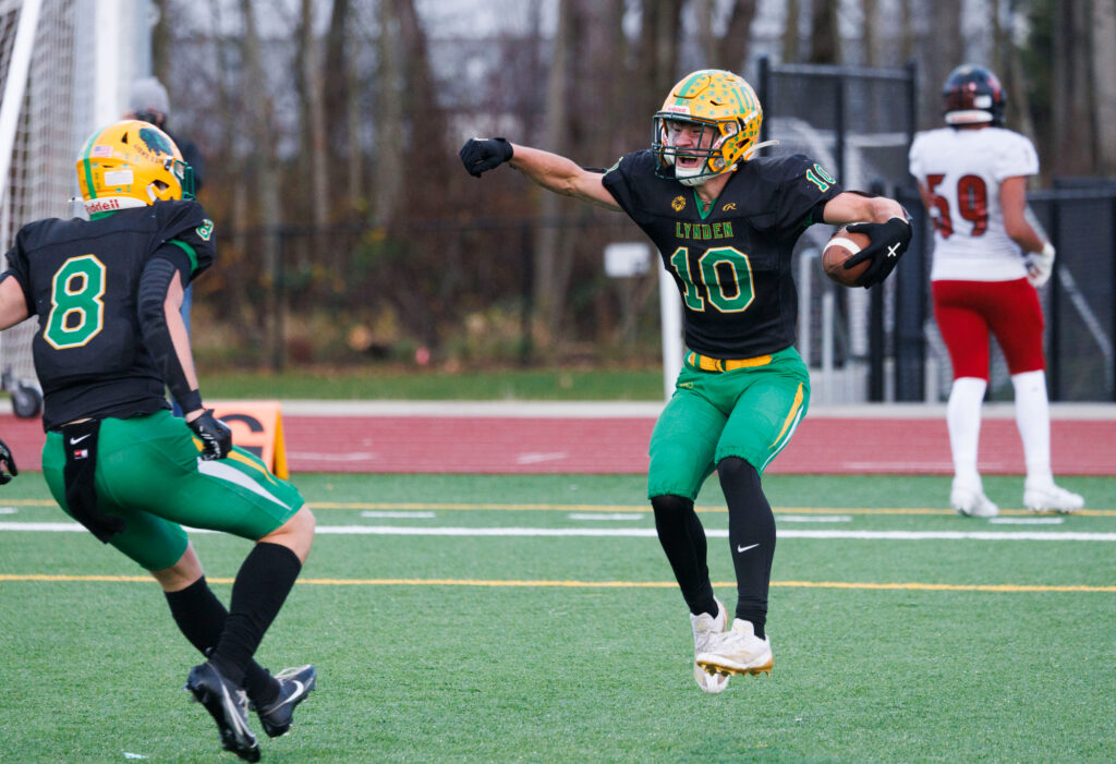 Lynden’s Brody Price celebrates with teammate Isaiah Oudman after a touchdown.