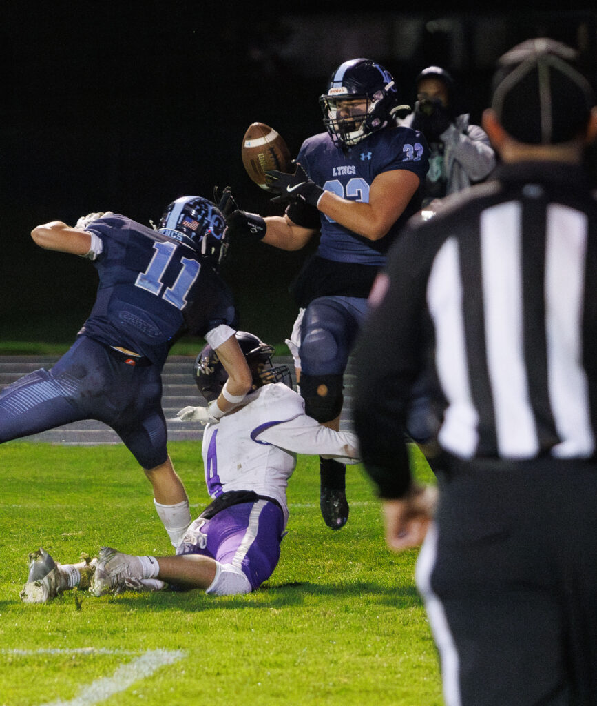 Lynden Christian's Trey Bosman hauls in a pass in the end zone for the Lyncs’ only touchdown on the night.