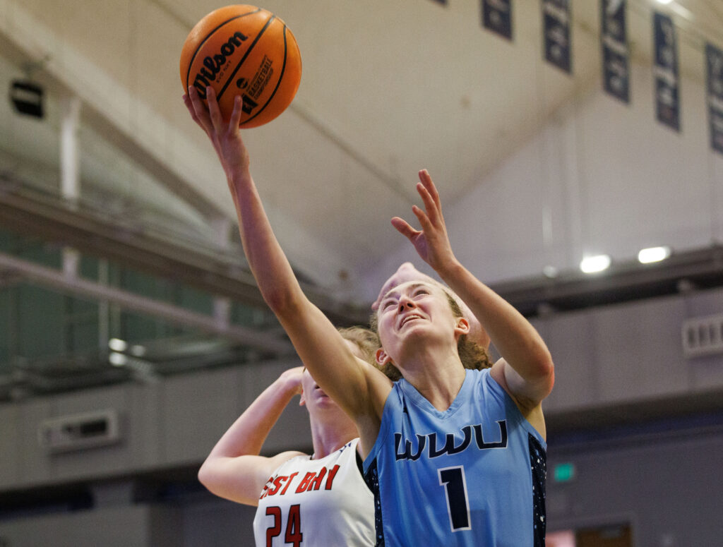 Western's Olivia Wikstrom scores a basket to lead the Vikings in scoring.