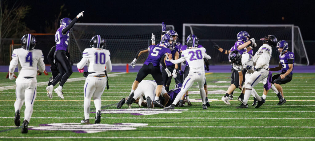 Anacortes players celebrate as they recover a mishandled kickoff by Foster.