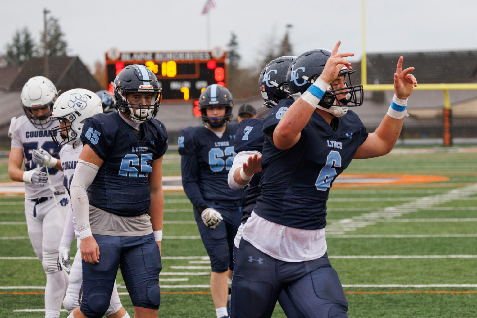 Lynden Christian's Chris Kooiman celebrates his touchdown.