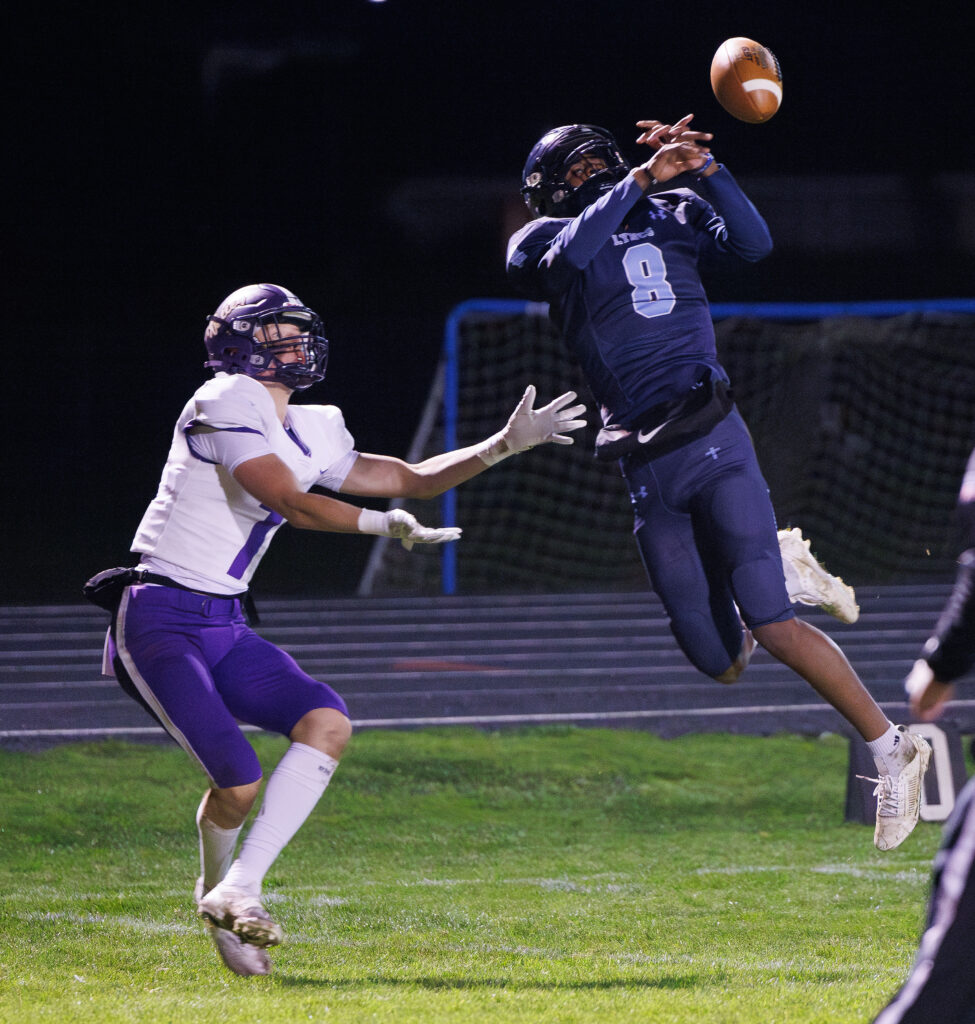 Lynden Christian's Jacob Penner nearly intercepts a pass intended for Nooksack Valley's Cole Coppinger.