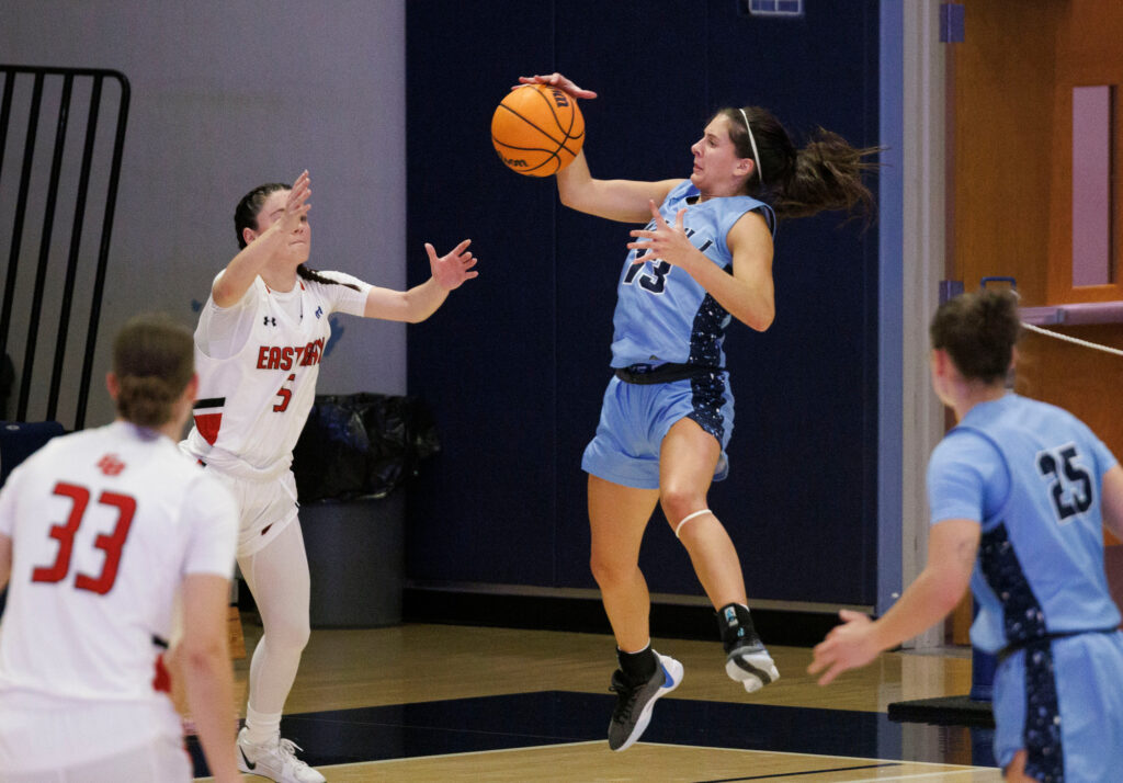 Western's Demi Dykstra intercepts a pass intended for a Cal State East Bay player.