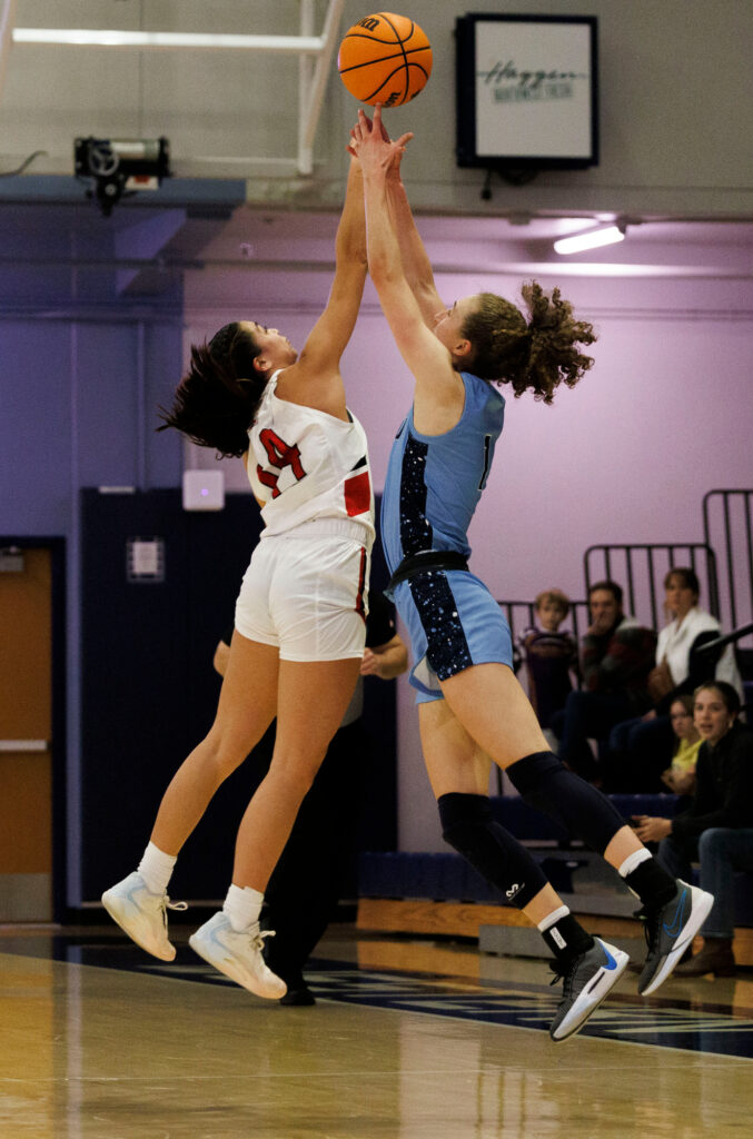 Western's Olivia Wikstrom battles for possession against a Cal State Easy Bay player.