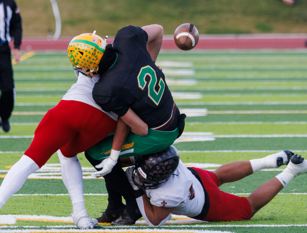 Archbishop Murphy defenders force a turnover from Lynden’s Brant Heppner.