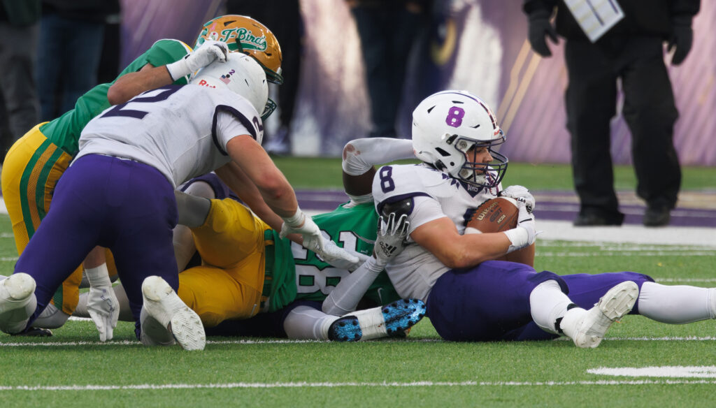 Anacortes senior Tyler Olson recovers a fumble by Tumwater.