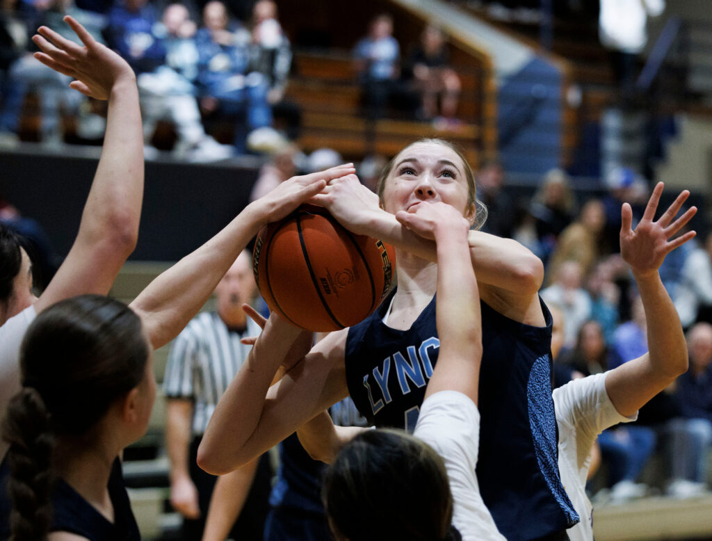 Lynden Christian’s Jocelyn Eshuis is fouled as she goes for the basket.