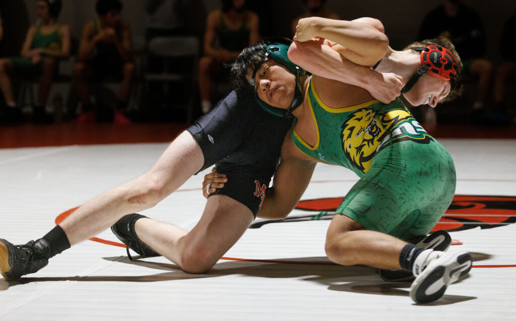 Lynden's Eliseo Ortiz Lopez flips Mount Baker's Holdyn Bell to win his match at a double dual with Lynden, Mount Vernon, Mount Baker and Bellingham on Dec. 4 in Bellingham.