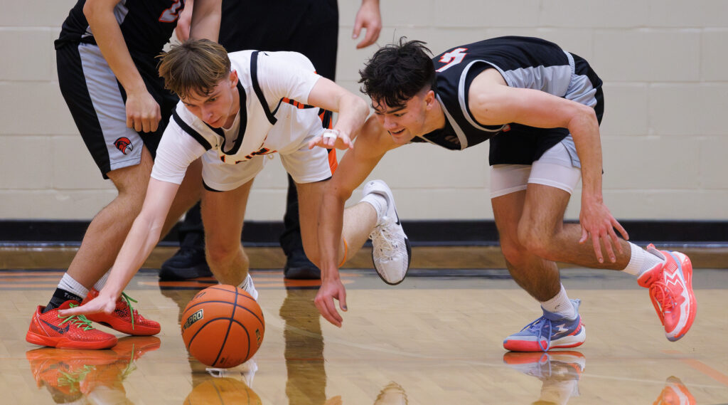 Blaine’s Landon Brown and Bellingham’s Evan Esaly scramble for a loose ball.